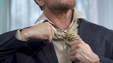 Guy trying to take off death rope from his neck, binding commitment, powerless
