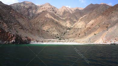 Ship travel sails along Musandam peninsula, Sultanate of Oman, Gulf of Oman.