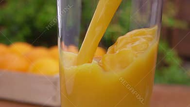 Orange juice poured into a glass