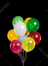Colorful party balloons on black background