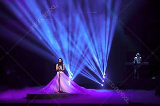 Singer with Ultra Violet stage effect
