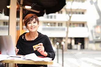 female client of co-working center make purchases by credit