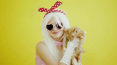 Blond girl with glasses in the image of anime doll