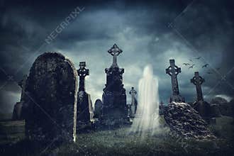 Spooky old graveyard and a ghost