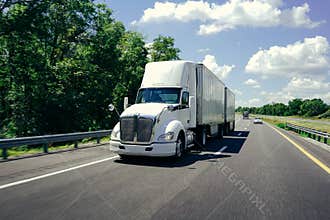 18 wheeler semi-truck on highway road beautiful day