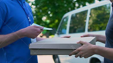 Deliveryman receiving money for pizza transporting, food delivery, part-time job