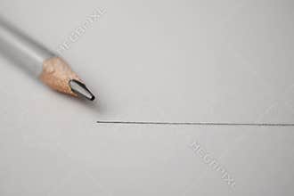 Macro shot of black pencil graphite with drawing line on texture