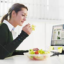 Woman eating salad