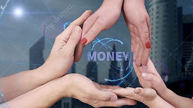Men`s, women`s and children`s hands show a hologram Money