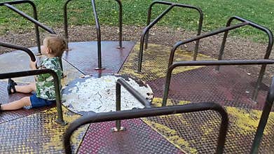 Little boy on a merry-go-round