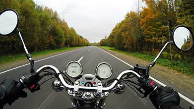 4K. Fast motorcycle riding on the beautiful forested road, wide point of view of rider. Classic cruiser/chopper forever!