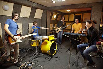 Rock band in studio. the joy of creation