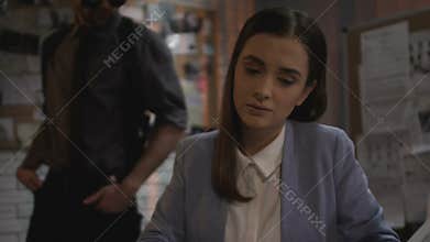 Woman detective searching for clue in fingerprints file criminal, investigation