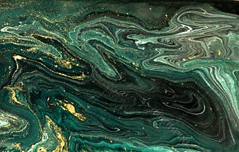 Green marble abstract acrylic background. Marbling artwork texture. Agate ripple pattern. Gold powder.
