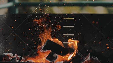 Slow motion barbecue camp charcoal grill fire and particles