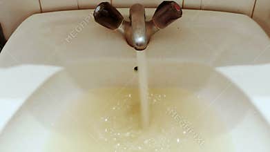 Wash basin full of dirty water