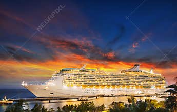 Cruise ship in port on sunset.
