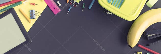 Banner Concept back to school apple backpack stationery on black background.
