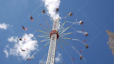 Flying swing carousel. View from the bottom of a carousel, which rotates at a high speed.