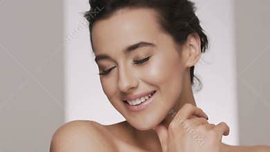 Attractive brunette model at studio background