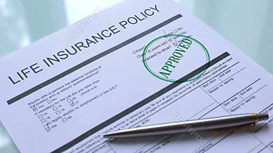 Approved document of life insurance policy, hand stamping seal on official paper