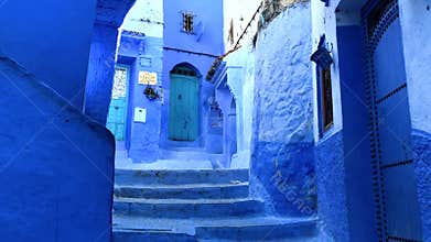 Walking in the street in old blue medina of the Chefchaouen City, Morocco