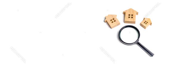 Three wooden houses on a white background. Buying and selling real estate, building new buildings, offices and homes. House search