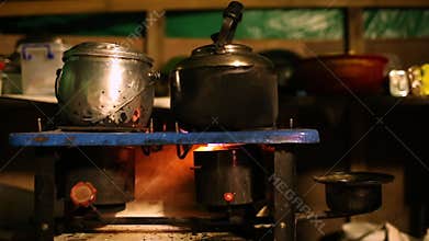 Tea pot on stove on a burner