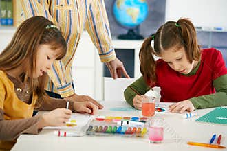 Children painting in art class