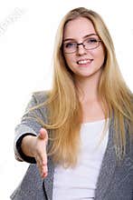 Studio shot of young happy businesswoman smiling while giving ha