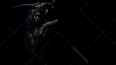 Gorgon Medusa turns around swinging her blade