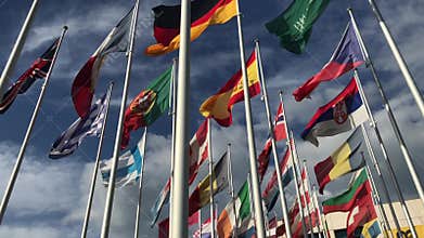 Flags of many countries vawing in the wind with blue sky and white clouds. for political, international trade, relationship concep