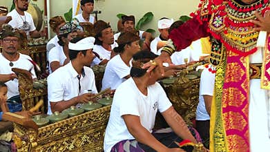 Bali, Indonesia - April 30, 2018: Unidentified balinese men playing traditional Balinese music instrument gamelan during royal