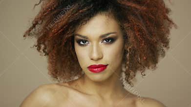 Charming ethnic model with curly hair