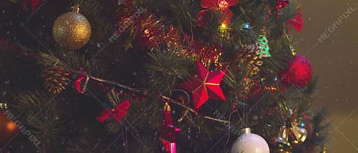 4,5k video of details of a Christmas tree, decorations and lights.