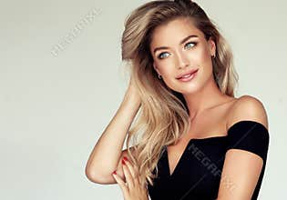 Portrait of gorgeous young woman with elegant make up and perfect golden hairstyle.