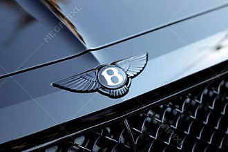 Close Up Of Bentley Winged B Logo On The Hood Of A Black Car