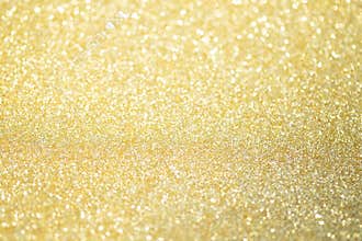 Abstract gold glitter bokeh lights with soft light background