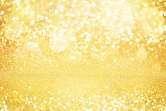 Abstract gold glitter bokeh lights with soft light background