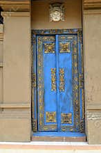 Traditional blue painted front doors of a house in Bali