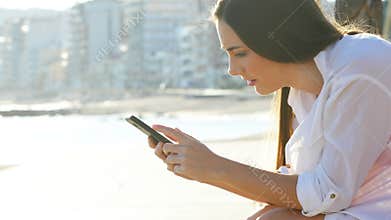 Sad girl receiving bad news checking smart phone