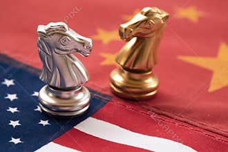 Chess game, two knights face to face on China and US national flags. Trade war concept. Conflict between two big countries, USA
