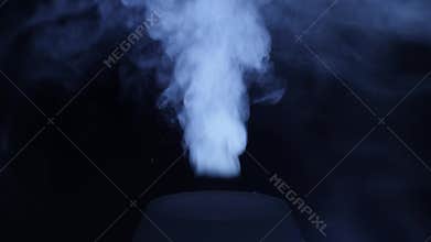 Working a humidifier with a blue circular light