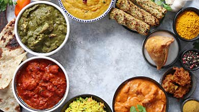 Assorted indian food on stone background. Dishes of indian cuisine