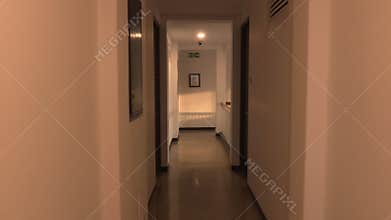 Walking down a hotel hallway corridor