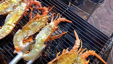 Cooking lobsters on street food market in Thailand