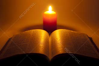 Bible and night candle.