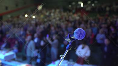 Seminar audience from stage, conference, Microphone on background of applause auditorium Close-Up group of business many