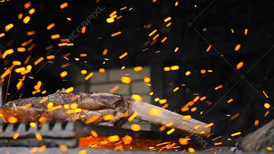 Beef steak is cooked on grill with sparks. Beef Rib BBQ