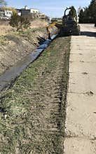 Drainage channel maintenance machine at work
